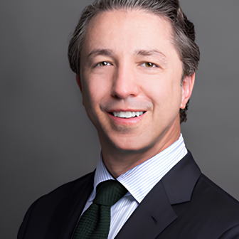 man in suit against gray background
